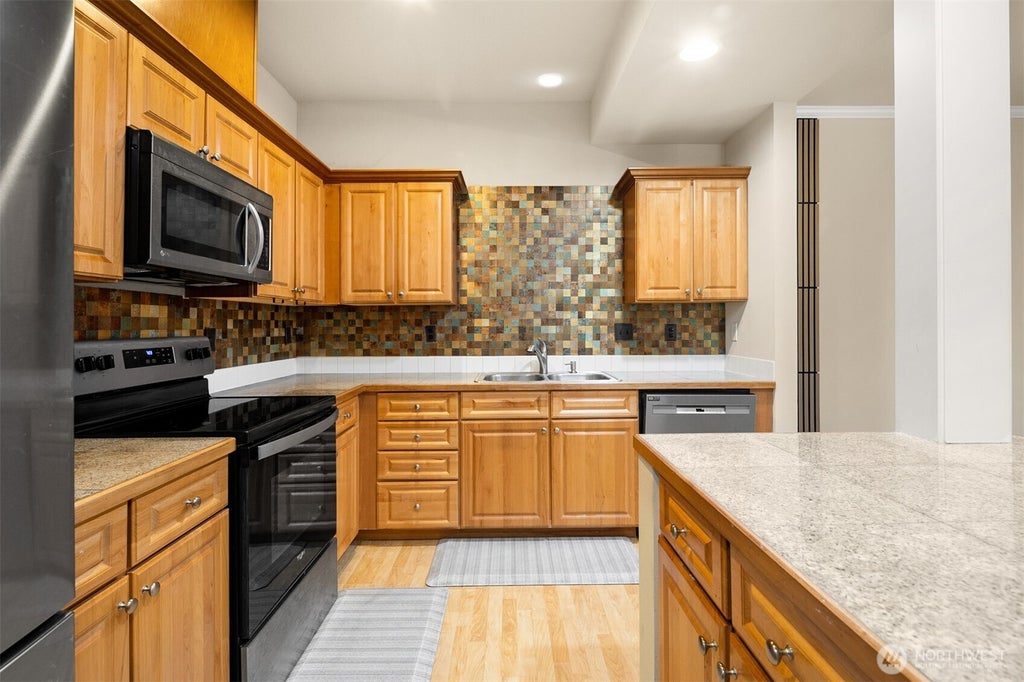 Photo of 10700 SE 260th Street #E103, Kent, WA 98030 (MLS # 2535391)