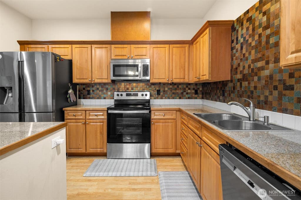 Photo of 10700 SE 260th Street #E103, Kent, WA 98030 (MLS # 2535391)