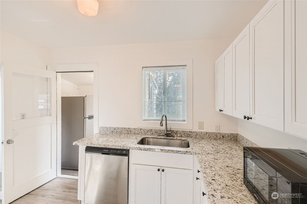 Photo of 2349 NE 127th Street, Seattle, WA 98125 (MLS # 2027343)