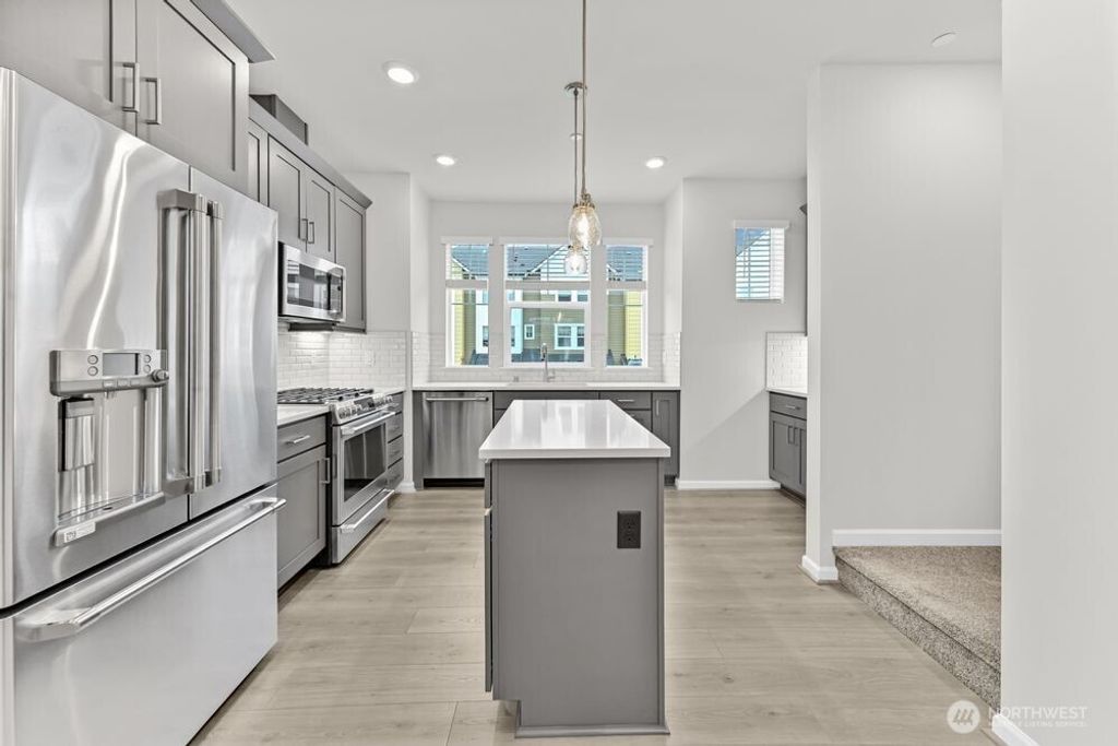 Photo of 19288 NE 69th Circle #104, Redmond, WA 98052 (MLS # 2444454)