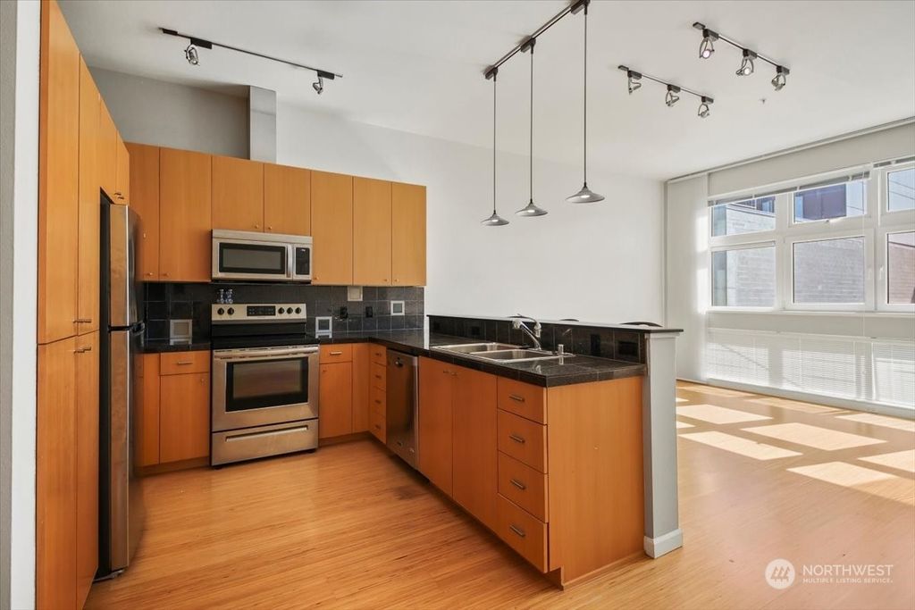 Photo of 17 W Mercer Street #220, Seattle, WA 98119 (MLS # 2077772)