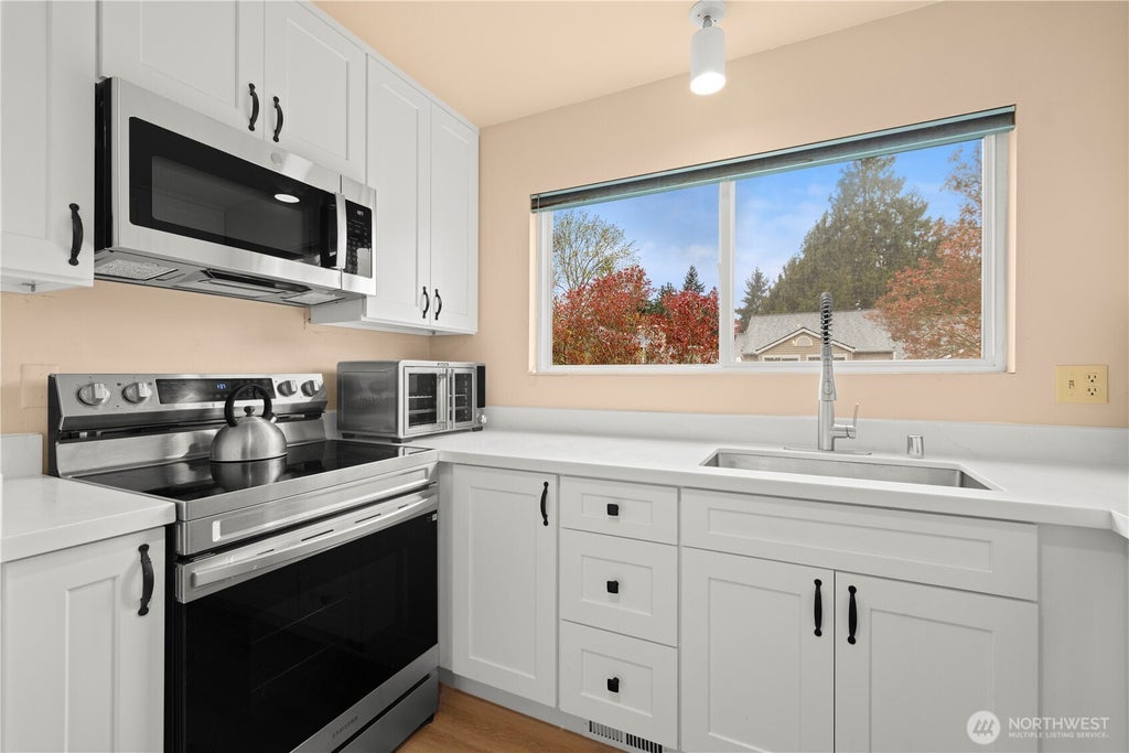 Photo of 12024 101st Avenue NE #E2, Kirkland, WA 98034 (MLS # 2542853)