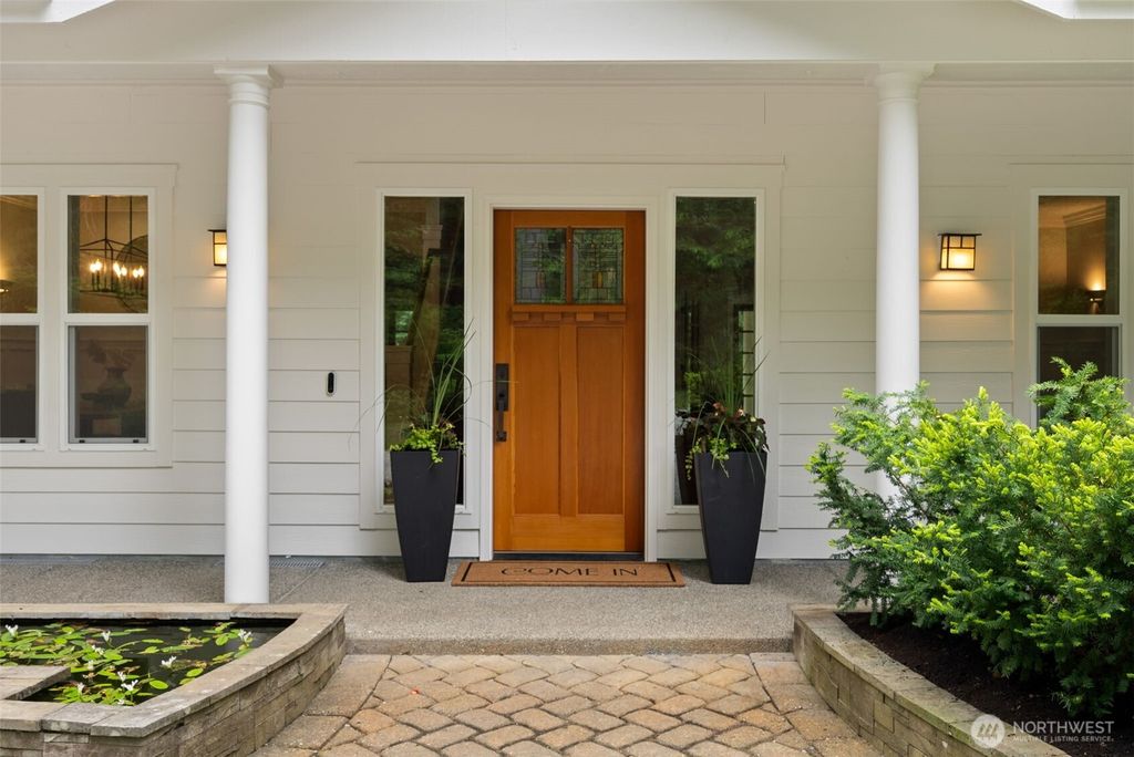 Photo of 6963 NE Hidden Cove Road, Bainbridge Island, WA 98110 (MLS # 2522567)
