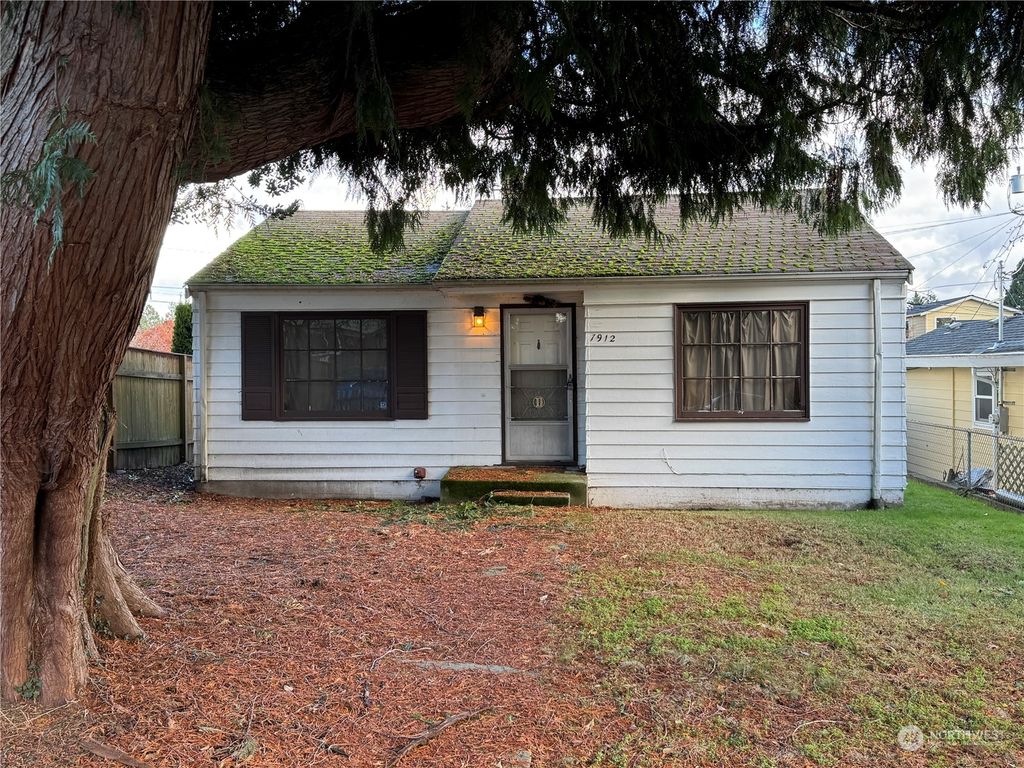 Photo of 7912 34th Avenue SW, Seattle, WA 98126 (MLS # 2312151)