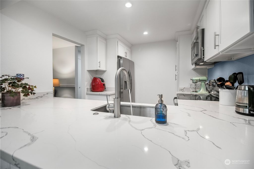 Photo of 12704 NE 144th Street #A104, Kirkland, WA 98034 (MLS # 2277227)