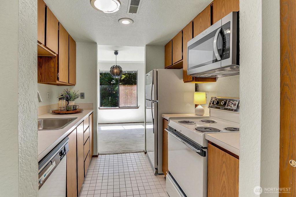 Photo of 10005 235th St St #A301, Kent, WA 98031 (MLS # 2407850)