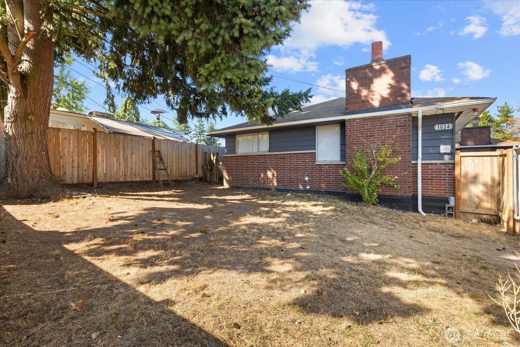 Photo of 1634 SW 114th Street, Seattle, WA 98146 (MLS # 2435077)