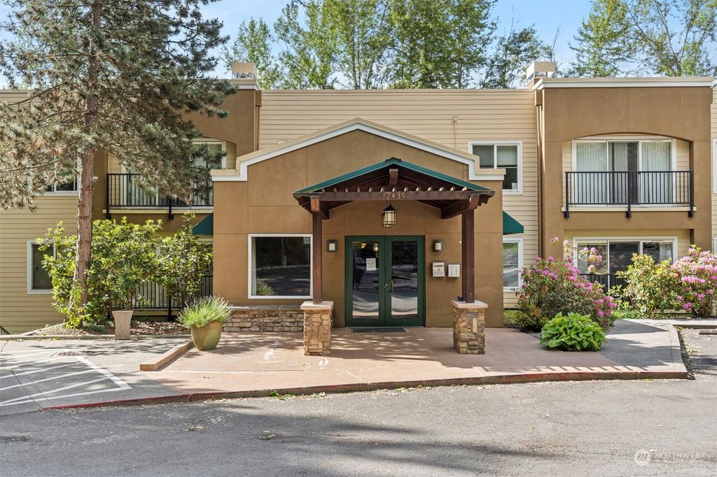 Photo of 12439 NE Totem Lake Way #103, Kirkland, WA 98034 (MLS # 2246804)