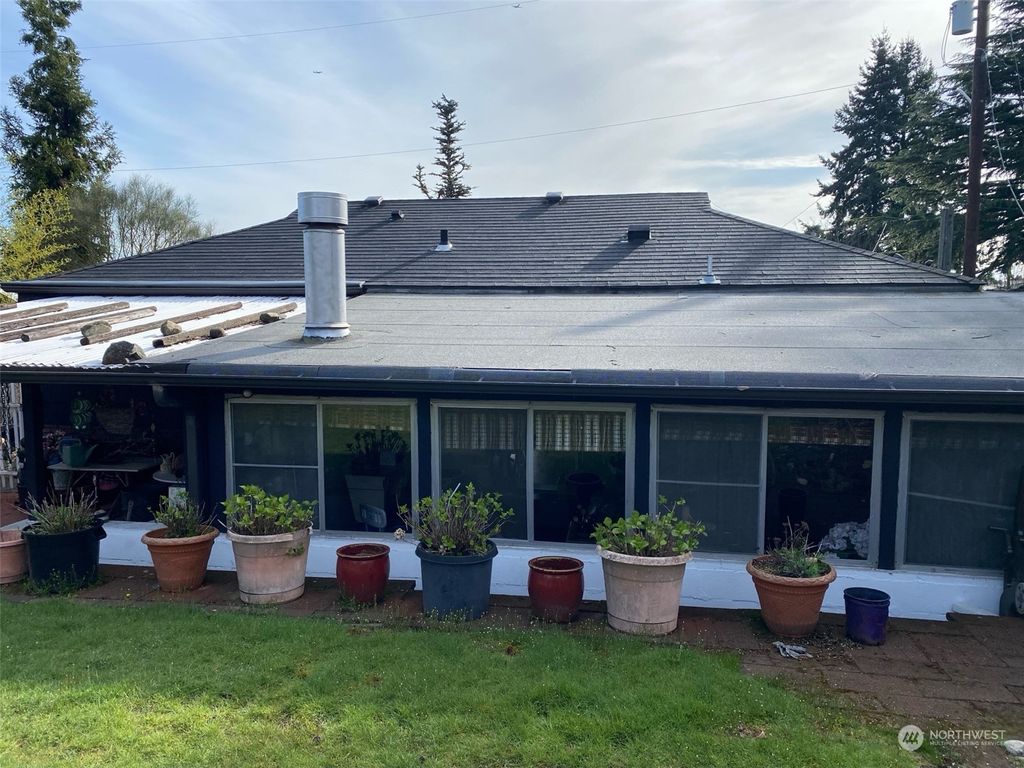 Photo of 10339 11th Avenue NW, Seattle, WA 98177 (MLS # 2264151)