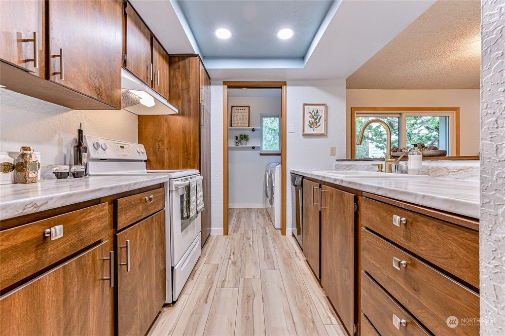 Photo of 14401 SE Petrovitsky Road #E-105, Renton, WA 98058 (MLS # 2040732)