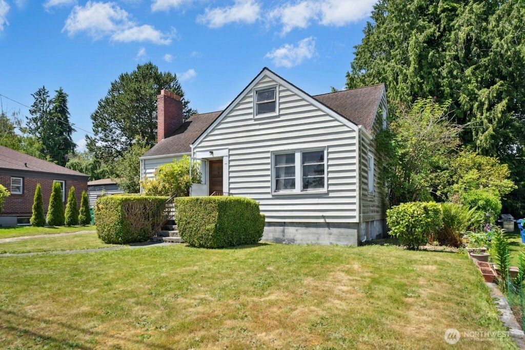 Photo of 8711 28th Avenue NW, Seattle, WA 98117 (MLS # 2377718)