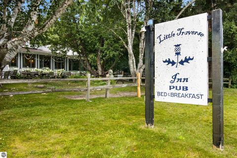 Tiny photo for 149 E Harbor Highway, Maple City, MI 49664 (MLS # 1939924)