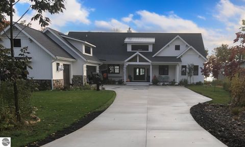 Photo of 340 N Nanagosa Trail, Suttons Bay, MI 49682 (MLS # 1941366)