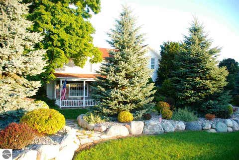 Photo of 8491 US-31 N, Williamsburg, MI 49690 (MLS # 1946540)
