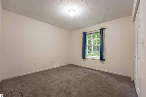 Tiny photo for 9479 Woodys Run, Traverse City, MI 49684 (MLS # 1949788)