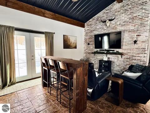 Photo of 8922 Whispering Pines Drive, Mancelona, MI 49659 (MLS # 1943454)