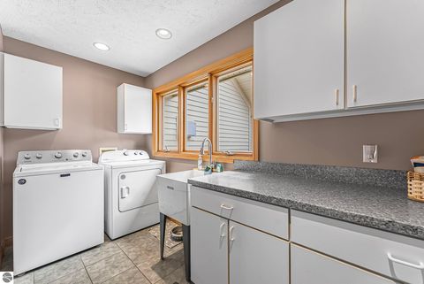 Tiny photo for 9871 E Woodcrest Court #20 & 21, Suttons Bay, MI 49682 (MLS # 1942990)