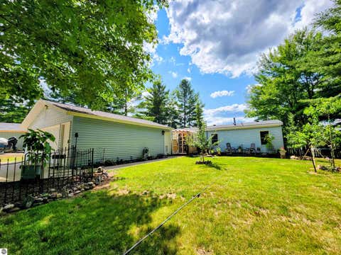 Photo of 6241 E Bass Lake Road, Kalkaska, MI 49646 (MLS # 1948637)