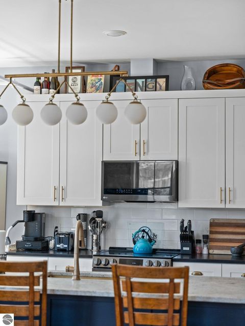 Tiny photo for 86 Washington Avenue #211, Manistee, MI 49660 (MLS # 1944263)