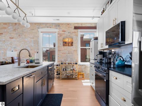 Tiny photo for 86 Washington Avenue #211, Manistee, MI 49660 (MLS # 1944263)