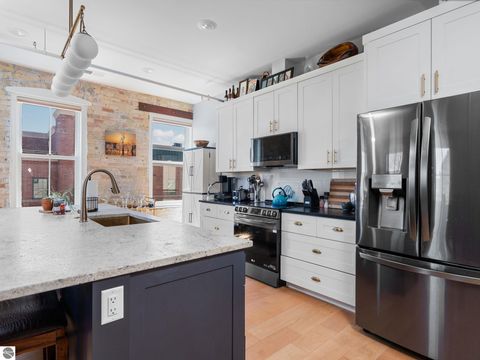 Tiny photo for 86 Washington Avenue #211, Manistee, MI 49660 (MLS # 1944263)