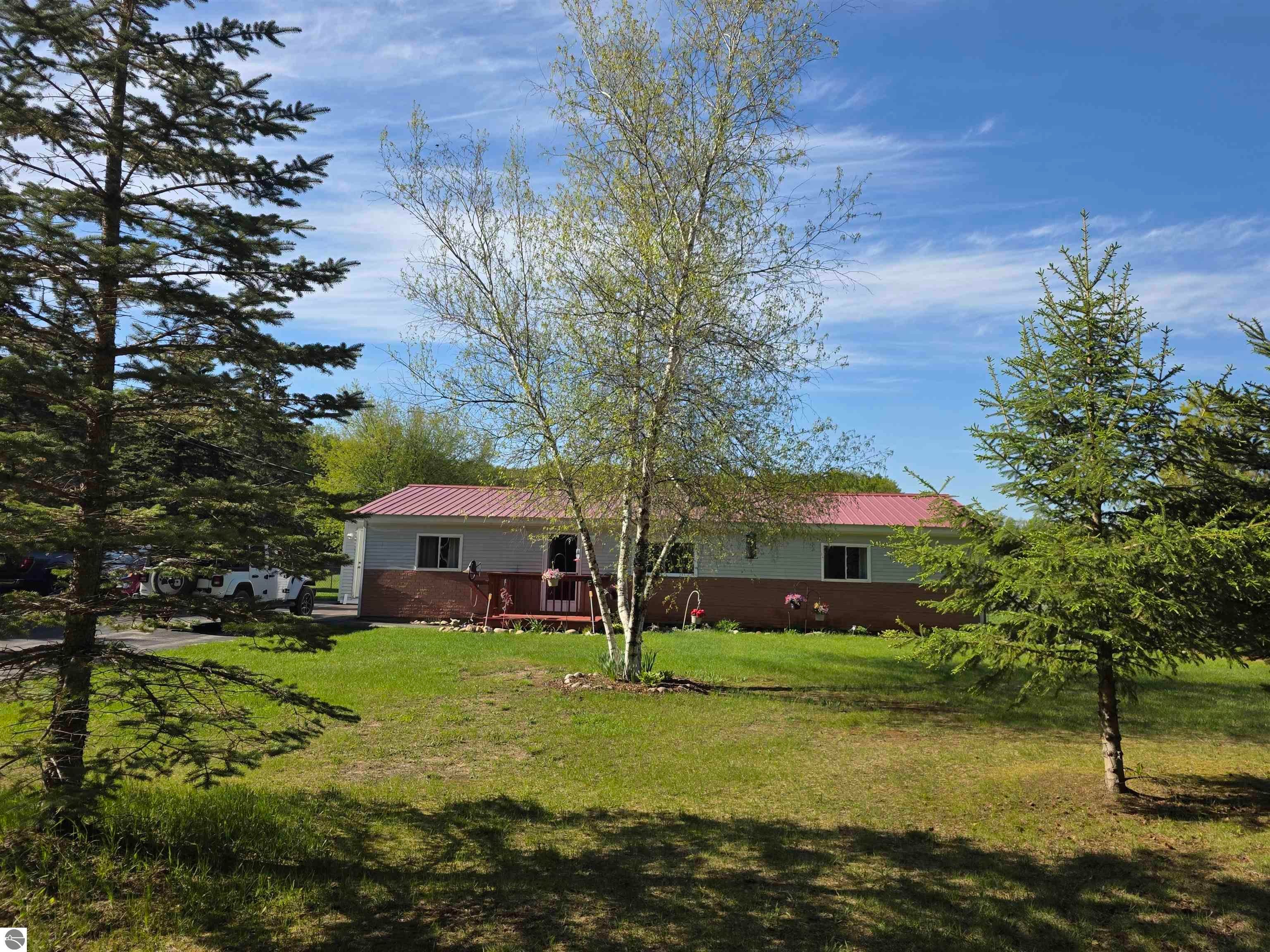 Photo 1 of 17 — 6675 NE Camp Tanuga Road, Kalkaska, MI 49646