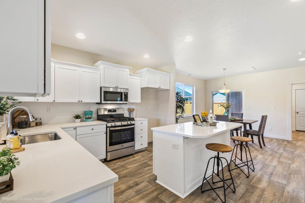 Photo of 8709 N Hemlock St, Spokane, WA 99208 (MLS # 202624369)