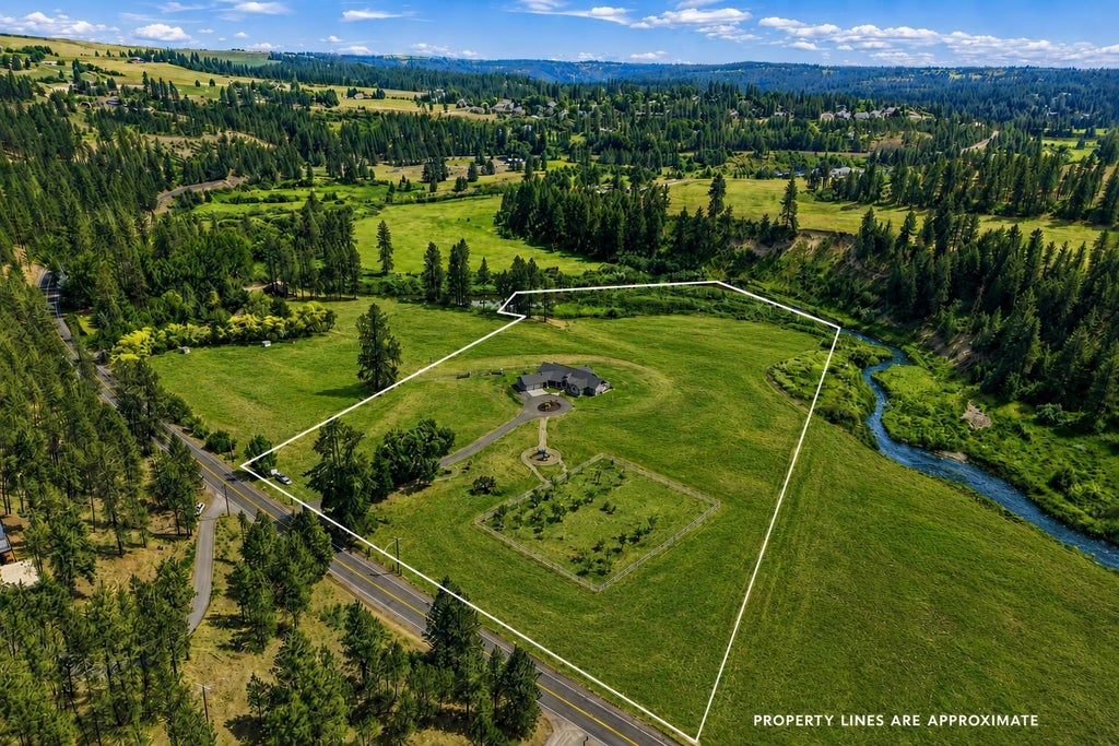 Photo of 10638 HANGMAN VALLEY Rd, Spokane, WA 99224 (MLS # 202624375)