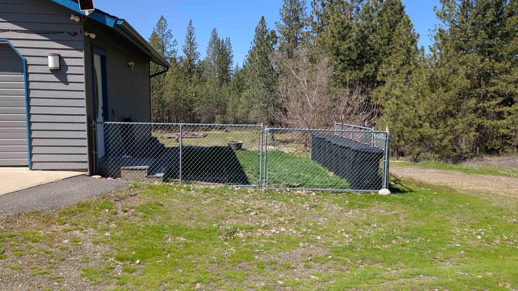 Photo of 4807 E Chatteroy Rd, Chattaroy, WA 99003 (MLS # 202616387)