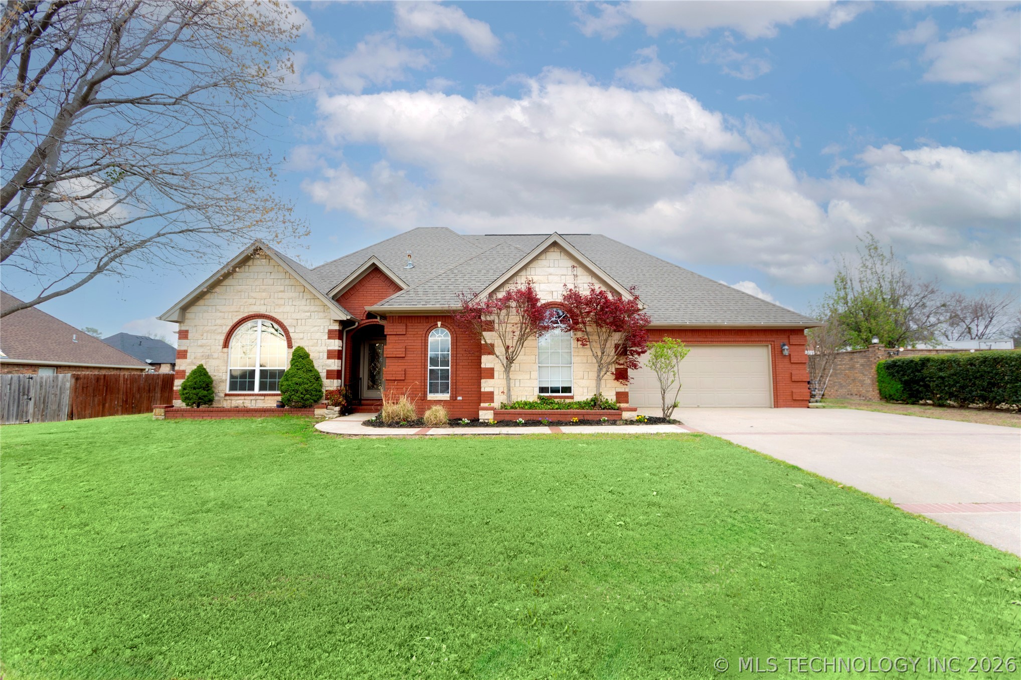 Brick and stone facade featuring arched windows