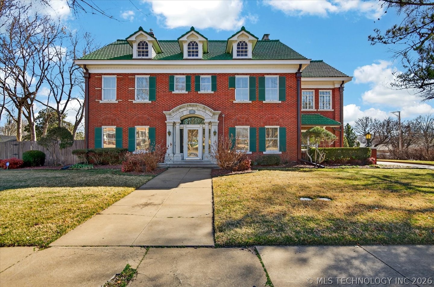 This Georgian style home has a limestone columned