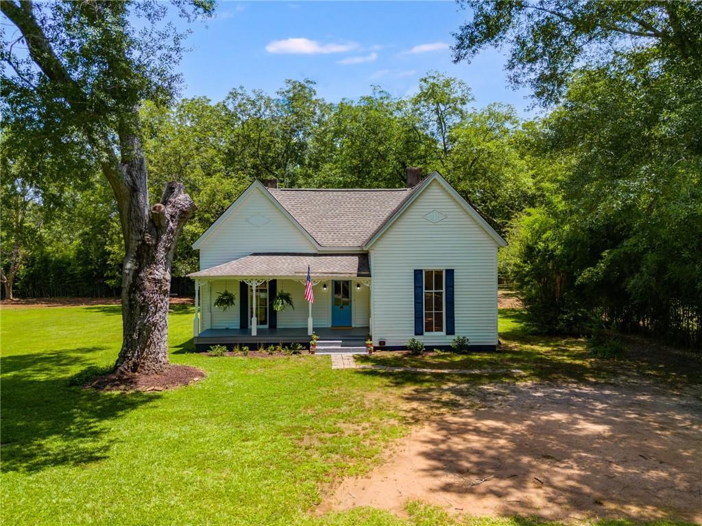 Historic Charm Meets Modern Living in the Heart of Madison’s Horse Country...... Welcome to The Parsonage—a meticulously renovated 1899 home set on 1.5 beautifully usable acres in Apalachee, GA. Surrounded by the scenic landscapes of Madison’s renowned horse country, this 3-bedroom, 2-bath residence strikes the perfect balance: classic Southern architecture paired with high-end modern finishes, as well as a thoughtful design and layout, all in an exceptionally convenient location. Inside, the home retains its iconic central hall layout with generously sized bedrooms, original architectural character, and refined updates throughout. A designer kitchen and spa-worthy baths blend form and function, while new windows, HVAC, and systems ensure comfort and efficiency for years to come. The level lot offers space to create your own retreat—add a pool, tennis court, or garden, or simply enjoy room to roam with minimal upkeep. There's even potential for small animals or hobby farming. Located just 10 minutes to Madison, 15 to Watkinsville, and 30 minutes to Athens, this is the rare property that feels worlds away, yet keeps everything within reach. Zoned for top-rated Morgan County schools and just a short drive to Lake Oconee, The Parsonage is ideal for those who appreciate history, quality, and the freedom of country living without sacrificing modern convenience.
Come experience this timeless treasure—schedule your private tour today.