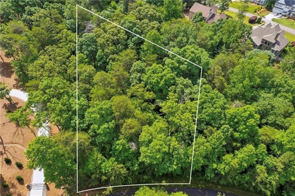 Lot/Land for sale in a Lake Front Community. All permit applications have been approved, and water meter in place. Includes all permits. Located in Ridgewater on Lanier on .80 acre lot with. Neighborhood has tennis courts, pool, clubhouse and community dock. Convenient to 400N, shopping, and restaurants. Owner would consider owner financing.