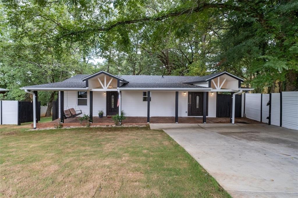 Fully renovated 3BR/2BA home in a community experiencing exciting growth, development, and investment. Sitting on a super large lot of about half an acre, the backyard features fresh Bermuda grass and offers the perfect setting for entertaining, gardening, play, or pets. A gorgeous oversized 400 sq ft front porch with concrete flooring and hanging lights adds charm and creates a welcoming outdoor living space. Inside, an extra versatile room provides additional space that can be used as a mudroom, waiting area, or cozy sitting nook. This beautifully updated property combines modern upgrades with charming curb appeal, featuring a new roof, new HVAC, an expanded driveway with ample parking, and security cameras for added peace of mind. The interior has been thoughtfully renovated with a brand-new kitchen, updated bathrooms, and stylish finishes throughout, offering a truly move-in ready experience. The home sits on a super large lot with double fencing, including a chain link fence and a privacy fence, maximizing both security and usability of the yard. Families will appreciate the convenience of being within walking distance to William J. Scott Elementary. Ideally located close to West Highlands and Perry Blvd, and just minutes from the Atlanta Belt Line, Westside Reservoir Park, Midtown, Buckhead, and a variety of shopping, dining, and entertainment options, this home offers comfort, privacy, and easy access to some of the city’s best amenities.