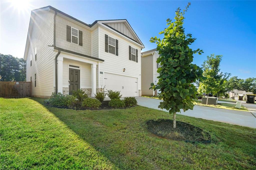 This like-new 5-bedroom, 3-bathroom home is a prime opportunity in a gated, craftsman-style community! Featuring luxury flooring, a bright open layout, an oversized owner's suite, private fenced patio, and a main-level guest suite, it's ideal for growing families or remote work living. Enjoy a warm upstairs loft, stainless steel appliances, and room to thrive in a community with 80 more homes coming soon. Don't miss out. Live now and build equity as the community develops! Available for sale or lease.
