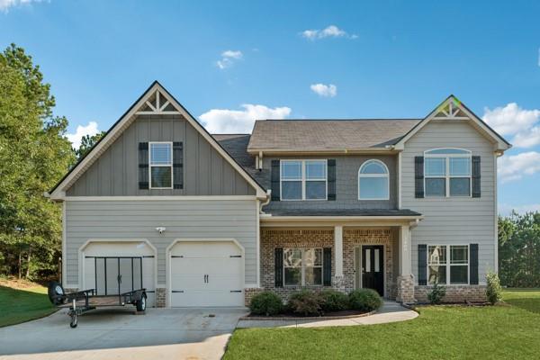 Shannon Lake, situated just off Hwy 78 in the esteemed Archer High School District, offers convenient access to shopping, dining, and recreation. Upon entering, you'll notice coffered ceilings, arched passageways, iron rail spindles, hardwood flooring, and kitchens equipped with granite and travertine. The Ryan features a private bedroom on the main level with a full bath, an island kitchen opening to a family room with a fireplace, and spacious living and dining areas ideal for entertaining. The Owner's suite is a must-see with a sitting room, boasting a spa-like bath. Additional features include spacious secondary bedrooms and a Jack and Jill bath. Privacy backyard is fenced and level with new grass.