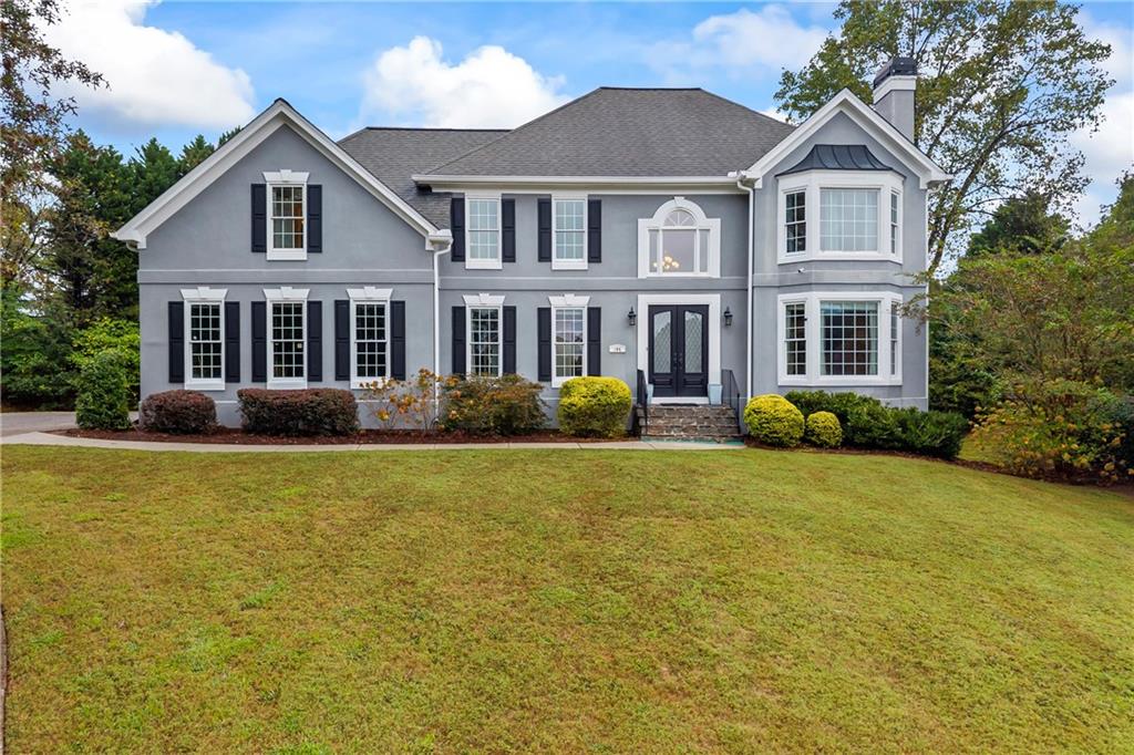 Stunning Stucco Home with Side-Entry Garage in Oak Leaf Subdivision, East Cobb This beautiful home sits gracefully at the top of a quiet cul-de-sac. The picturesque drive up reveals elegant glass double doors that set the tone for the home's sophistication. Step inside to a grand two-story foyer, where hardwood floors flow throughout the main level. The formal living and dining rooms open seamlessly to one another, creating the perfect setting for entertaining. The soaring two-story family room boasts a cozy fireplace framed by custom built-in bookshelves. The renovated chef's kitchen is a showstopper, featuring stainless steel appliances including double ovens, cooktop, dishwasher, and refrigerator. A spacious island with storage on both sides, bar seating, and a breakfast nook make this the heart of the home. With four spice racks, a pantry, and abundant cabinetry, storage is never an issue. Just off the family room, enjoy a relaxing sunroom and deck for effortless indoor/outdoor entertaining. The main level also includes a convenient half bath, laundry room, coat closet, and additional pantry. Upstairs, the primary suite is a retreat of its own, with a fireplace, renovated spa-inspired bathroom featuring a soaking tub and separate shower, and a large walk-in closet. A secondary bedroom with a private bath is perfect for guests, while two additional bedrooms share a Jack & Jill bathroom. The finished basement offers a full in-law suite, complete with its own kitchen (stove, refrigerator, dishwasher, sink, cabinetry), laundry room, living room, and multiple bedrooms including one with an en-suite bath. A flex room makes an ideal office, while double doors open to the patio and spacious, level backyard --perfect for gatherings. With its thoughtful updates, abundant storage, and versatile living spaces, this home truly lives like two homes in one. Located just minutes from shopping, dining, Truist Park, and major highways I-285 and I-75. This East Cobb gem is ready to welcome you home. Preferred Closing Attorney is Campbell and Brannon, 3405 Dallas Hwy, Marietta (678) 816-4098
