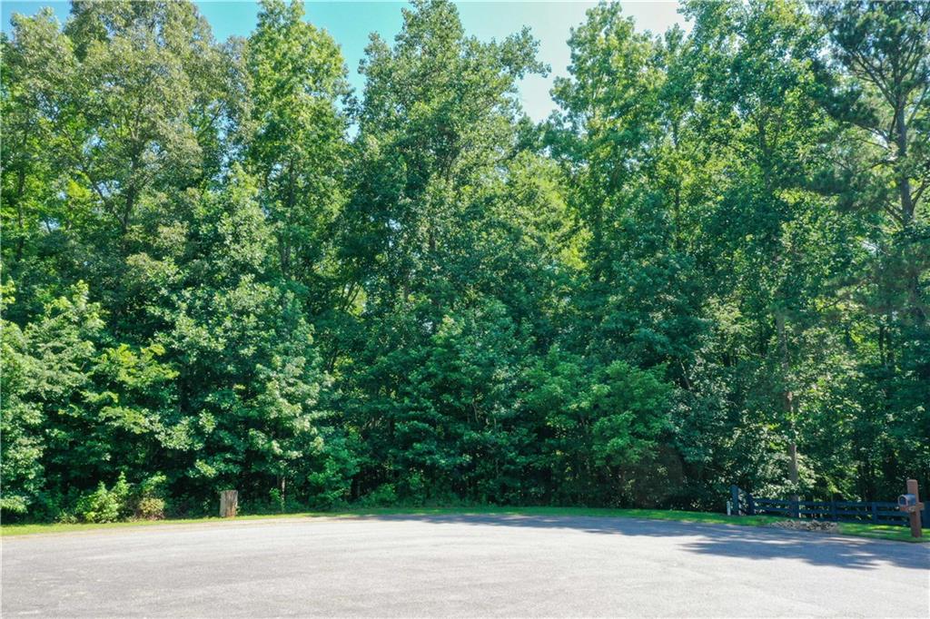 Stunning 2-Acre Residential Lot in Cumming, GA
Location, Luxury, and Potential – Nestled in a peaceful cul-de-sac in the highly sought-after Cumming, GA, this 2-acre residential lot offers the perfect setting to build your dream home. Surrounded by high-end properties and new developments, this lot provides an ideal blend of privacy and convenience.
Prime Buildable Lot – The lot is gently sloping, perfect for a basement home with scenic views, making it an exceptional choice for those seeking a custom home with ample space. Enjoy the tranquility of a quiet neighborhood, while still being close to the best that Cumming has to offer.
Top-Rated Schools – Located in a prestigious school district, this lot is perfect for families looking for a neighborhood with excellent educational opportunities.
Unmatched Convenience – With easy access to local amenities, shopping, dining, and major roadways, you're just minutes away from everything you need. Experience the best of both worlds – a serene, private setting with quick access to all the conveniences of city living.
Endless Possibilities – Whether you're ready to build your dream estate, or simply looking for an investment in an area of high growth, this lot checks all the boxes.
Schedule a tour today and see for yourself why this lot is the perfect place to make your vision a reality!