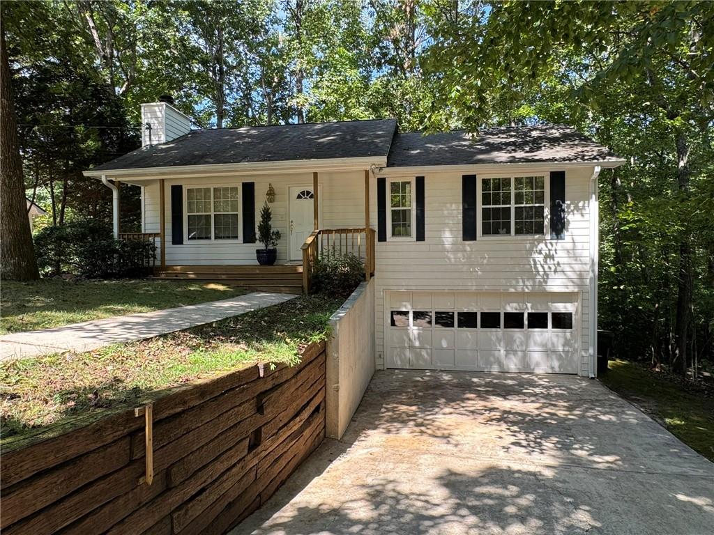 Experience ultimate privacy and park like beauty in this move in ready home in the quiet lake community of Shady Shores! Appealing raised ranch with new carpet and interior paint is nestled in a private, wooded nature lovers paradise with pristine frontage on BaldRidge Creek providing direct access from the backyard for you to launch your kayak, canoe or paddle board in the water and enjoy a peaceful but invigorating paddle into Lake Lanier. (See the Virtual Tour video for an exciting demonstration!) For your larger power boat, there is a private community boat ramp with private parking area for an optional $95 per year fee for access. OVERSIZED 2 Car GARAGE w/ auto door opener will accommodate larger vehicles or boats plus extra storage space (or convert to additional living space). This is a 2 BR home BUT THERE IS A ROOM WITH WINDOW IN THE UNFINISHED dry poured wall basement that can be an office, exercise or rec room or man/woman cave or play room or music room. Soak in the breathtaking natural beauty and view of Bald Ridge Creek from your back deck. Follow the easy walk trail to the creek to launch your watercraft. NO HOA. Large boat/RV parking pad in addition to the double driveway. Could also use to park your car near the front door. Award winning Forsyth County Schools including East Forsyth High. Easy and quick access to GA 400 takes you to Alpharetta, Atlanta, Premium Outlet Mall or North GA mountains. Convenient to the vibrant new Cumming City Center, and The Collection at Forsyth and Northside Hospital. Hiking trails and Tidwell Park on the lake are also close at hand. Your private and serene backyard connects directly to US Corp property so your tranquil view of the hardwood forest and water will never change. Home has fresh interior paint and new carpet and has been very well maintained. Everything works perfectly to keep you comfortable and provide all the comforts of home. So you can move in immediately. Don't miss this opportunity to own a slice of paradise. Won't last! This home can be reached by car without ever leaving the pavement via Century Drive. AGENTS SEE PRIVATE REMARKS.