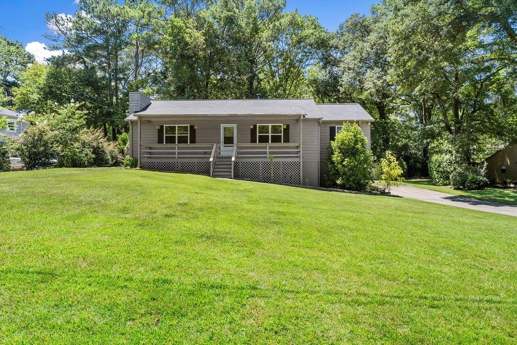 AMAZING LOCATION!! Immaculate home in quiet,neighborhood just minutes to 575/75. Town Center-KSU-Dining- Trails. Rocking chair front porch welcomes you to this home with 3 nice sized bedrooms, Great Room with Stone fireplace, spacious updated kitchen with all appliances. Finished basement with full bath, and two large separate rooms.(4th Bedroom) Deck accessed from dining area looks onto huge level back yard. Spacious 2 car Garage and additional storage building. Excellent Schools!!
