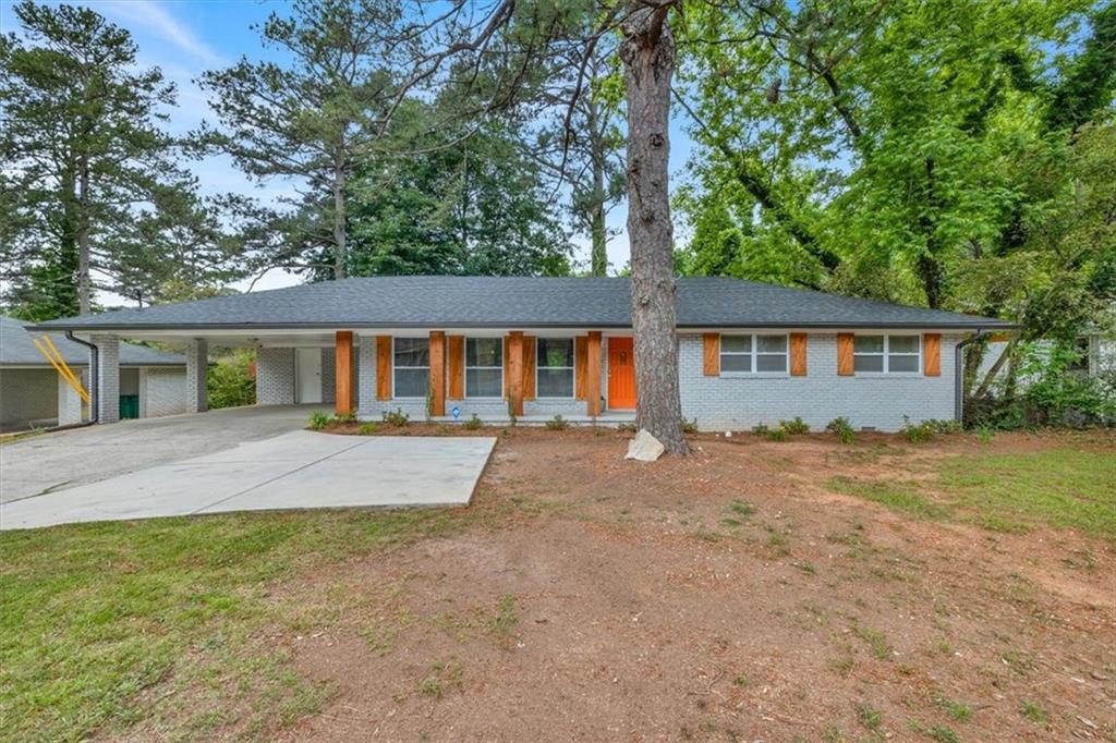 Discover this beautifully updated 3-bedroom, 2-bath traditional brick ranch, recently operated as a successful Airbnb. Inside, you'll find an inviting modern open concept living area that flows seamlessly into a stylish kitchen featuring soft-close white shaker cabinets, an oversized island, granite countertops, and modern design. This move-in ready home perfectly blends classic charm with modern comfort.