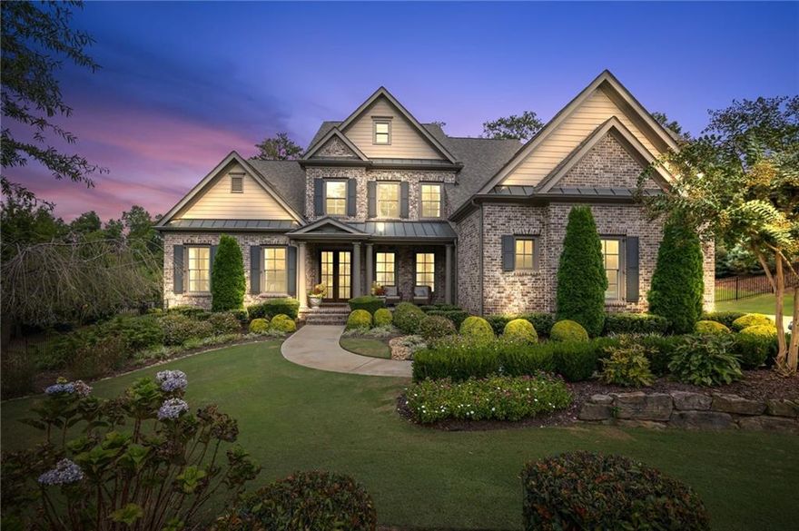 Timeless elegance meets resort-style living in this exquisite 4-sided brick estate, located on over an acre of professionally landscaped privacy in the exclusive Manor Golf & Country Club. Overlooking the picturesque 9th green, this custom 6-bedroom, 5.5-bath home built in 2019, offers 5,700+ finished square footage of thoughtfully designed space, with only one adjacent neighbor—privacy and serenity at its finest. A grand two-story foyer welcomes you with rich red oak hardwoods, soaring ceilings, and natural light that flows into expansive living spaces. The formal dining room and private office set the tone for refined elegance. The open-concept living room features rich wood coffered ceilings, built-in bookshelves and a cozy fireplace, all flowing seamlessly into the chef’s kitchen—equipped with Wolf appliances, Sub-Zero refrigerator/freezer, a built-in coffee & espresso system and a generous island for entertaining.  Off the kitchen, a separate guest bedroom with its own en-suite bath provides a quiet, private space, — perfect for overnight guests or extended family. A spacious laundry/mudroom also off the kitchen, includes a custom pet washing station—designed with every detail in mind. The main-level primary suite is a true retreat, offering a tranquil sitting area, direct access to the covered porch, a spa-inspired bathroom with dual vanities, soaking tub and a large custom walk-in closet with built-ins. Upstairs, you’ll find three spacious bedrooms—one with an en-suite bath—and an oversized entertainment loft perfect for a home theater, playroom or additional living space. The finished terrace level is an entertainer’s dream, featuring a stunning wet bar with wine fridge and ice maker, pool table room, a fitness studio, flex bedroom and ample space for guests or multi-use living. Step outside into your private backyard resort-style oasis, framed by elegant wrought iron fencing and lush custom landscaping. Enjoy a heated Pebble Tec saltwater pool and spa, outdoor kitchen cabana with elegant wood ceilings, a built-in grill and stone masonry fireplace, Sunpak heaters and remote-controlled sunshades—ideal for year-round entertaining. Additional features include 3-car garage with 9-ft wide doors and epoxy floors, additional 1569 sq ft of unfinished space at terrace level and Smart home and irrigation system. As a resident of The Manor, enjoy access to a Tom Watson-designed golf course, indoor and outdoor tennis courts, resort-style pools, a world-class fitness center, clubhouse dining and an active social calendar. This is more than a home—it's a lifestyle of elegance, comfort, and unmatched community living.