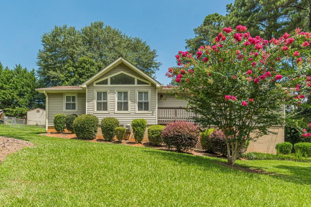 Well-built traditional home in established neighborhood with top schools! Charming floorplan with plantation shutters, spacious great room w/rock fireplace and lovely screened porch, perfect for quiet evenings. Sunny chef's kitchen, formal dining room, and updated baths. Three generous bedrooms with great closet space. Large basement for future expansion and excellent storage. Needs some TLC (paint/carpet) and sold as-is. Convenient to airport and major highways! Hurry today!