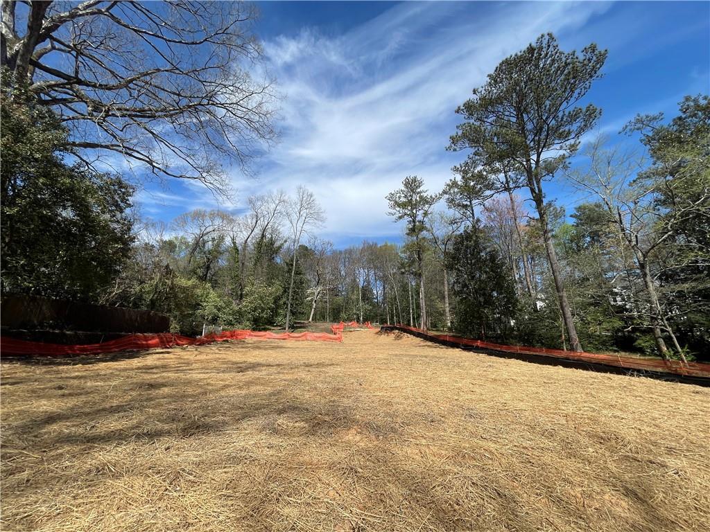 Build your dream home on this 1.5+ acre ESTATE lot in sought after TUXEDO PARK! Enough acreage for main house, pool, pool/guest house, tennis/pickleball court, etc. Lot encompasses approximately 200 feet of road frontage and extends approximately 590 feet for a total of 66,836sf. Seller has razed previous home, removed trees, and graded the lot.