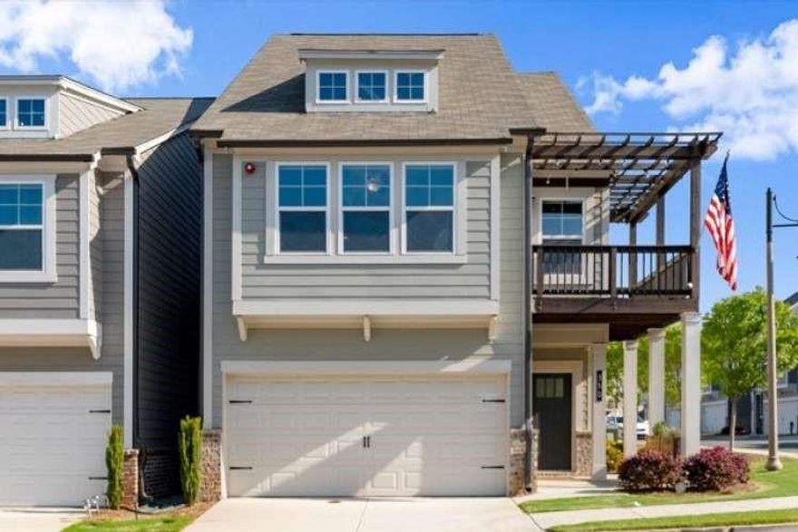 Motivated Sellers!!! Immaculate turn-key ready home waiting just for you! This is a rare corner unit, Athena floorplan with 4th bedroom option, plus beautiful views from the primary suite and balcony. Don't miss it! Over $99,000 in builder upgrades. Sleek and modern. Quartz throughout, frameless shower, larger walk-in closets, 5" hardwood floors, solid oak stairs, professional EPOXY garage floor. Breathe easy with whole house Broan air purification system. Huge & Spacious! Open floor plan with nice light kitchen, dining and living room with fireplace and built-ins. Second floor are the bedrooms; the primary suite has an amazing walk-in closet with a window and a romantic private balcony and gorgeous upgraded bath. Third floor is the fun floor! A spacious bonus/bedroom for cozy movies, gym, office, play room... whatever you need, with it's own bathroom and closet. Semi-detatched, maintenance free living near downtown Woodstock only a few miles away to enjoy shopping & dining with all your extra free time.