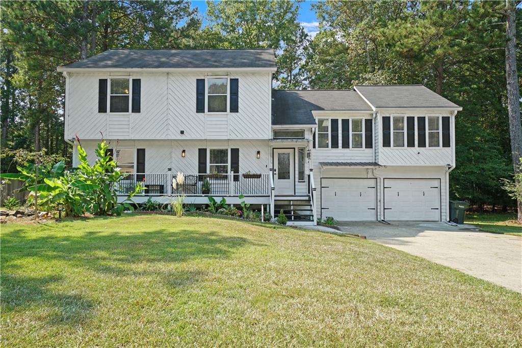 Welcome home to this beautifully updated and truly move-in ready 4-bedroom, 2.5-bath retreat in the heart of Kennesaw. Nestled in a quiet community with no HOA, this home has been thoughtfully upgraded to blend charm, comfort, and modern living. The curb appeal is undeniable. Lush landscaping frames the home, leading you to the rocking chair front porch—recently added by the seller and stretching across the front, a rare feature in this neighborhood. It’s the perfect place to enjoy your morning coffee while listening to the gentle sounds of the custom waterfall feature, setting a tone of peace and relaxation before you even step inside. Just beyond the front door, the expansive living room welcomes you in. Vaulted ceilings and skylights fill the space with natural light, while newly added recessed lighting ensures a warm, inviting glow at any time of day. This spacious room offers endless possibilities—whether you’re hosting friends for game night, enjoying quiet evenings by the cozy fireplace, or gathering with family, it’s a space designed to bring people together and make lasting memories. The kitchen is a true centerpiece, blending style and function with ease. Crisp white cabinetry complements the timeless Corian countertops and tile backsplash, while the new farmhouse-style stainless steel sink adds both charm and practicality. Completing the space, all appliances are stainless steel, highlighted by an upgraded vent hood. Spacious and open, the kitchen flows effortlessly between the living and dining areas, making entertaining and everyday life a breeze. Just a few steps up from the living room, you’ll find the oversized primary suite, offering his-and-hers closets, a spa-like ensuite with double vanities and brand-new granite counters, and a soaking tub to unwind after a long day. Two large secondary bedrooms are also on this level, each with walk-in closets of their own. The hall bath shines with an upgraded vanity topped with marble and natural light from its skylight. The lower level provides incredible flexibility with a sprawling fourth bedroom—ideal as a guest suite, media room, or multi-generational living space. With its own half bath and private deck, it feels like a retreat all its own. Out back, the level yard is designed for connection and fun. The newly rebuilt deck and addition of the retractable awning (2022) creates the perfect space for dining al fresco, while the firepit area below invites evenings gathered with friends and family under the stars. Located in the sought-after Cobb County School District, this home is just minutes from Swift-Cantrell Park, Kennesaw Mountain, Kennesaw Marketplace, and vibrant Downtown Kennesaw. Easy access to US 41 and I-75 makes commuting effortless. This isn’t just a house—it’s a home where every space was designed for living, gathering, and creating lasting memories. Schedule your private showing today!