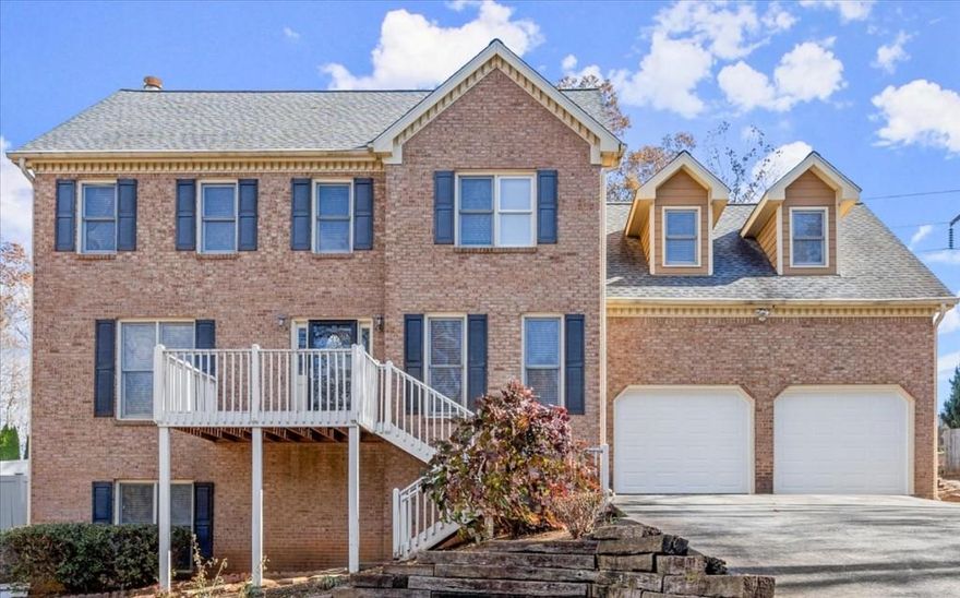 DON'T MISS this lovely brick home located in the highly desirable East Cobb Blackwell Chase subdivision. Boasting 5 bedrooms and 3.5 baths, this home offers a perfect blend of space, style, and functionality. The main level features  hardwood floors throughout, a large dining room perfect for entertaining, and a versatile living room that could be used  as a home office. Relax in the oversized family room with a cozy fireplace, or step outside onto the expansive deck overlooking a flat, private backyard. The upper level features a large primary bedroom and ensuite bathroom with double vanities, jetted tub, separate shower and his and hers walk in closets. Three large additional bedrooms with lots of closet spaces and a bathroom. The fully finished, self-contained basement is a standout feature. Complete with a full kitchen, living room, bedroom, bathroom, an additional room ideal as an office, exercise room, or another bedroom, plus large bonus room that can be used as a walk in closet, craft room or office space.  It is perfect for an in-law suite, a college student, or even as a potential Rental Space For Extra Income. Updates, include a new garage doors and newer stainless steel appliances. With its convenient location and thoughtful layout, this home offers everything anyone needs and more.