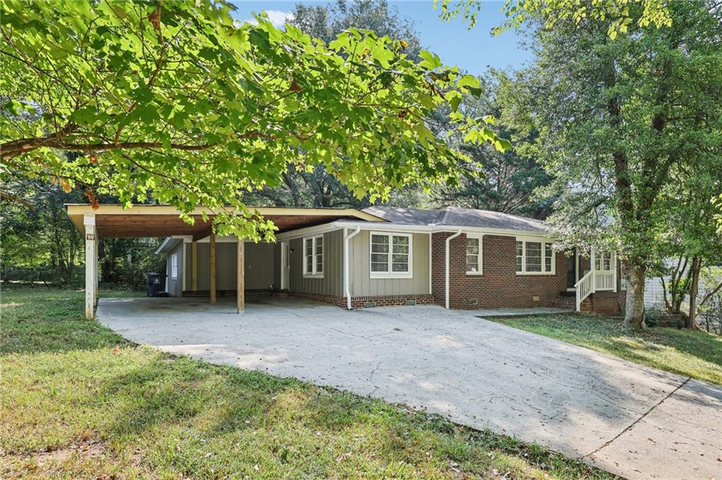 Welcome Home to this newly renovated, 4 bedroom 2.5 bath, brick ranch home in the heart of downtown Acworth! Home is Move in Ready with LVP plank flooring throughout, a family room, spacious kitchen with abundant oak cabinetry, updated countertops, a separate dining room and a versatile split bedroom or roommate layout with 2 bedrooms and a full bath on each side of the house with separate entry. There is also a deck outside overlooking the level, backyard that’s perfect for relaxation. Situated close to shopping, schools, dining and quick access to I-75, this one will not last…don’t miss this opportunity…Call to schedule your tour today.!!