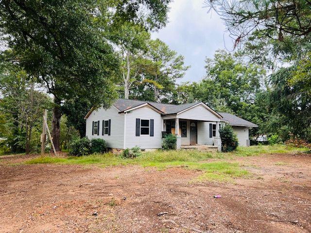 Classic 1955 ranch sits on a level 1.09-acre lot in the heart of Cobb County with excellent fix and flip potential. Large and level lot with all utilities and sewer beside is zoned R-20 and has potential for 2 new homes with 20,000 + square foot lots. Amazing central location only 4 miles to Interstate 75 and great county road access to Marietta, Woodstock, Roswell and beyond could be an ideal property for commercial rezoning to locate your business. Just 1 block off Canton Road/ Highway 5 with 30,000 cars-per-day ADT. New roof in 2023, some new windows, and some new sheetrock and wiring replaced recently. Come explore the many opportunities that await!