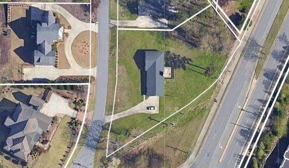 BUILDER ALERT! Large residential lot with panoramic city views in upscale residential area with beautiful million dollar plus homes. The value of the property is in the land, but the home is in great shape with many updates sitting on a lot that is level across the front, gently sloping to the back. With the classic ranch 3 bed, 2 bath main level, this home also features a basement with a bedroom and bath as well as a garage. The lot is currently zoned R30 but is surrounded by much more dense housing so partitioning to 2 lots at R20 should be easily doable. A package with an older survey, sewer & water map, recent area activity and more is available on request. Please schedule an appointment before accessing/walking the property to respect the privacy of the sellers - however, it is fairly easy to get a general idea of the lot's topo layout from a drive-by as it is viewable on 3 sides.